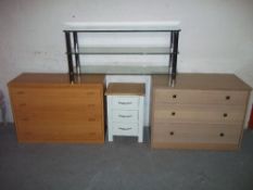 THREE MODERN CHESTS OF DRAWERS AND A GLASS TV STAND