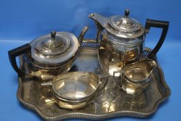 A WHITE METAL TEA SET ON TRAY