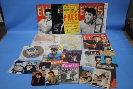 A BOX OF ELVIS MEMORABILIA TO INCLUDE FACSIMILE MAGAZINES, PHOTOGRAPHS ETC.