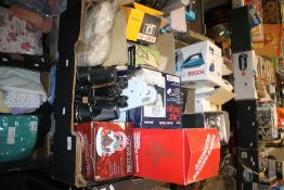 TWO TRAYS OF MAINLY BOXED ITEMS TO INCLUDE IRONS, CAGE BINGO, A PAIR OF BINOCULARS UNCASED ETC. (