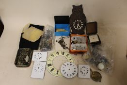 A BOX OF ASSORTED CLOCK PARTS