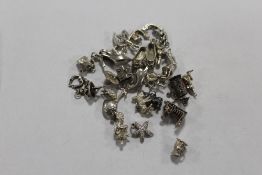 A BAG OF LOOSE SILVER CHARMS APPROX WEIGHT 69G