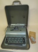 A CASED VINTAGE TYPEWRITER