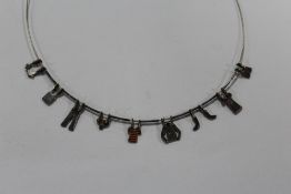 A NOVELTY STERLING SILVER WASHING LINE NECKLACE
