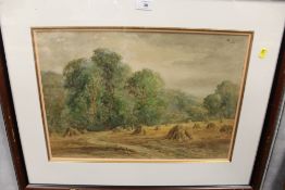 A FRAMED AND GLAZED WATERCOLOUR DEPICTING A RURAL SCENE, WITH CORN STOOKS , SIGNED W. RAMSEY LOWER