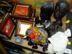 A SMALL TRAY OF COLLECTABLES TO INCLUDE AN EBONISED WOODEN ELEPHANT FIGURE AND FRAMED AND GLAZED CAP