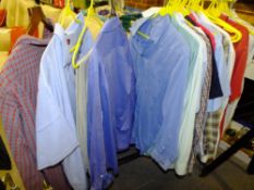A RAIL OF GENTS SHIRTS AND TROUSERS (RAIL NOT INCLUDED)