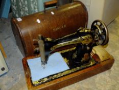 A CASED VINTAGE SINGER SEWING MACHINE