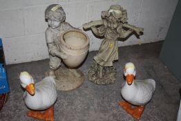 TWO GARDEN FIGURES TOGETHER WITH 2 CERAMIC GEESE