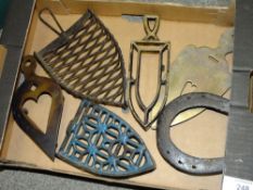 A BOX OF CAST METAL TRIVET STANDS