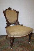 AN ANTIQUE CARVED MAHOGANY UPHOLSTERED BEDROOM CHAIR