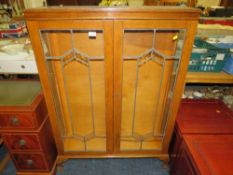 AN OAK GLAZED CHINA CABINET H 126 CM W 92 CM