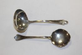 A HALLMARKED SILVER LADLE, TOGETHER WITH A HALLMARKED SILVER SPOON (2) APPROX WEIGHT - 59G