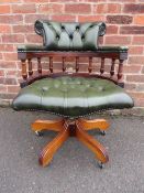 A REPRODUCTION GREEN LEATHER SWIVEL OFFICE ARMCHAIR