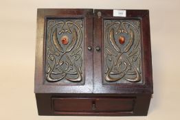 A REPRODUCTION MAHOGANY LETTER RACK WITH ART NOUVEAU STYLE PANEL