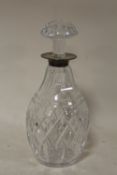 A HALLMARKED SILVER RIMMED CUT GLASS DECANTER OVERALL HEIGHT INCLUDING STOPPER - 25CM