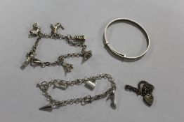 TWO SILVER CHARM BRACELETS, TOGETHER WITH A SILVER BANGLE AND A SMALL SILVER BRACELET (4) APPROX