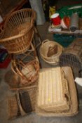 A SELECTION OF WICKERWARE TO INCLUDE A COT AND BASKETS