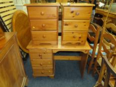A HONEY PINE DESK AND A PAIR OF BEDSIDE CHESTS (3)