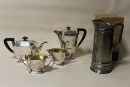 AN ART DECO STYLE SILVER PLATED FOUR PIECE TEA SERVICE TOGETHER WITH A BOXED CLAUDIO DESIGN METAL JU
