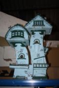 A BIRDHOUSE IN THE FORM OF A BUILDING HEIGHT -76 CM