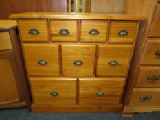 A MODERN PINE NINE DRAWER CHEST W-88 CM