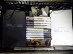 TWO PLAYSTATION 2 CONSOLES WITH CONTROLLERS AND GAMES