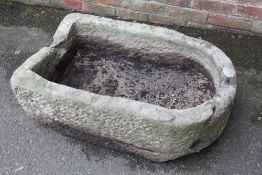 A LARGE SANDSTONE PUMP TROUGH - L 92 CM, W 57 CM