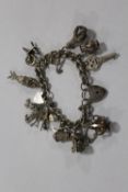 A LARGE HALLMARKED SILVER CHARM BRACELET APPROX WEIGHT 70.8G