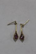 A PAIR OF 9 CARAT GOLD EARRINGS SET WITH PINK AND CLEAR STONES APPROX WEIGHT - 2.1G