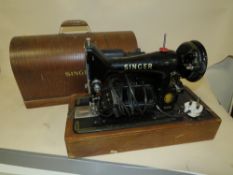 A CASED SINGER SEWING MACHINE