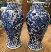 A PAIR OF CHINESE BLUE AND WHITE VASES WITH FOUR CHARACTER MARK UNDER GLAZED MARK TO BASE, HAND
