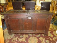 AN ANTIQUE OAK TRIPLE PANEL COFFER H-73 CM W-131 CM - SOME DAMAGE