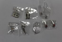 SEVEN PAIRS OF PACKAGED SILVER EARRINGS