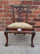 A REPRODUCTION MAHOGANY MINIATURE CHAIR