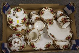 A TRAY OF ROYAL ALBERT OLD COUNTRY ROSES CHINA TO INCLUDE A CAKE STAND, CUPS AND SAUCERS ETC.