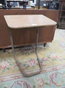 A VINTAGE STAPLES CANTILEVER TABLE WITH ORIGINAL LABEL