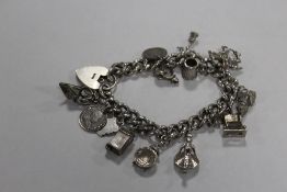 A LARGE VINTAGE HALLMARKED SILVER CHARM BRACELET APPROX WEIGHT 78.9G