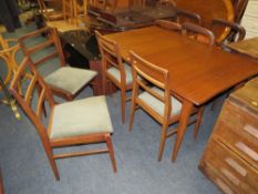 A VINTAGE GORDON RUSSELL STYLE EXTENDING TEAK DINING TABLE AND FOUR CHAIRS - TABLE H-73 CM L-132