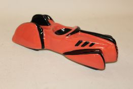 A LORNA BAILEY CERAMIC FIGURE OF A VINTAGE RACE CAR