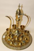 A MIDDLE EASTERN STYLE JEWELED TEAPOT AND SIX GOBLETS WITH TRAY (8)
