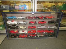 A GLASS WALL HANGING DISPLAY CASE CONTAINING DIE CAST MODEL CARS, CABINET W 106 CM, H 57 CM
