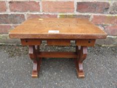 A SMALL CARVED WOODEN STOOL