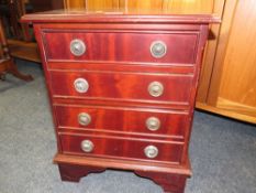 A SMALL REPRODUCTION FOUR DRAWER CHEST H-51 CM W-42 CM
