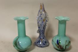 AN END OF DAY GLASS FISH SHAPED VASE, TOGETHER WITH A PAIR OF GREEN GLASS VASES (3)