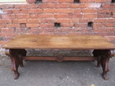 AN UNUSUAL 19TH CENTURY CARVED MAHOGANY DOUBLE SIDED BENCH, the plain two plank top supported by two