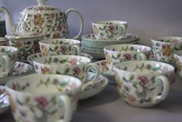 A COLLECTION OF MINTON 'HADDON HALL' PATTERN TEAWARE, comprising 12 tea cups, 12 saucers, 1 lidded