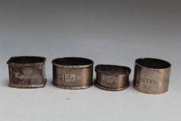 FOUR ASSORTED HALLMARKED SILVER NAPKIN RINGS TO INCLUDE A SCOTTISH EXAMPLE BY WAKELY & WHEELER -