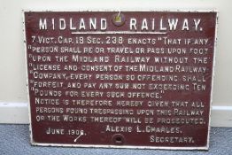 A MIDLAND RAILWAY CAST IRON TRESPASS SIGN, dated June 1906, 51 x 67 cm