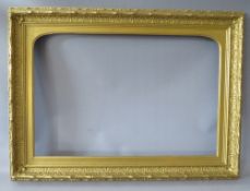 A 19TH CENTURY DECORATIVE GOLD FRAME, with arched top integral slip, some restoration, frame W 8 cm,